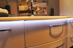 LED Strip Light Used To Line The Edge Of A Kitchen Worktop, Creating A Wash Of Light Down The Set Of Drawers